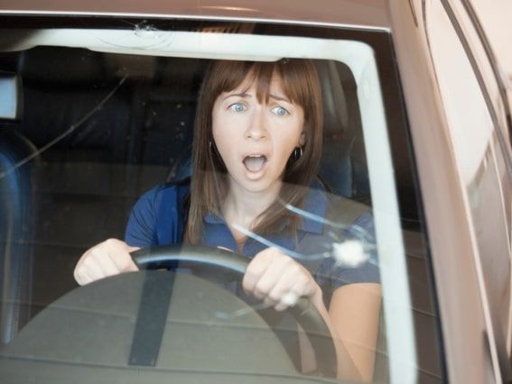 Cracked windshield being evaluated for auto glass repair in Arizona